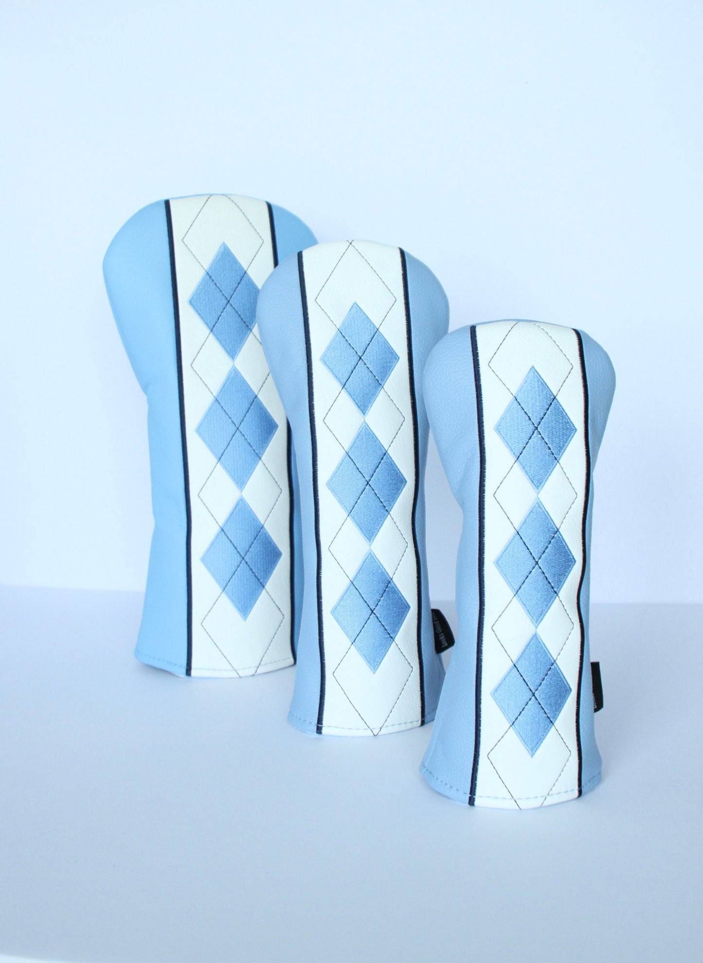 Sky blue and navy argyle golf headcover 3-piece set close-up view by Looks Good Golf