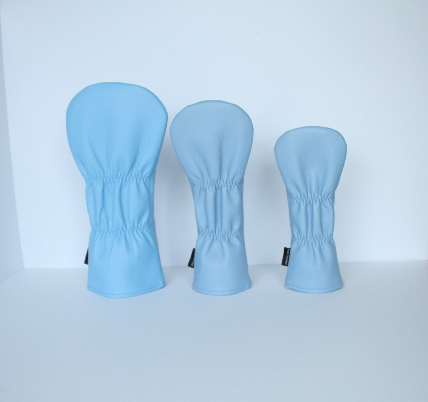 Sky blue and navy argyle golf headcover set back view by Looks Good Golf