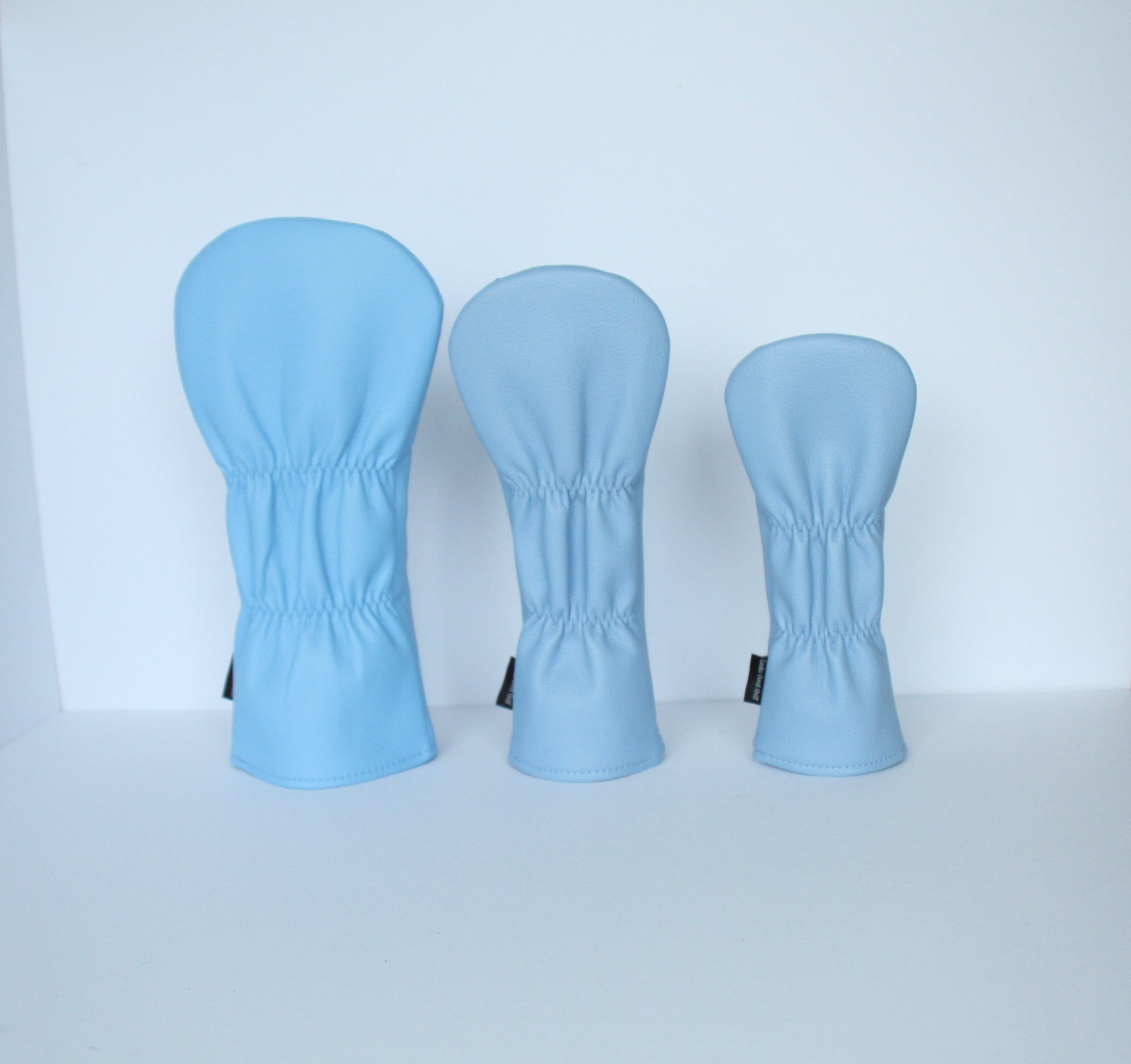 Sky blue and navy argyle golf headcover set back view by Looks Good Golf