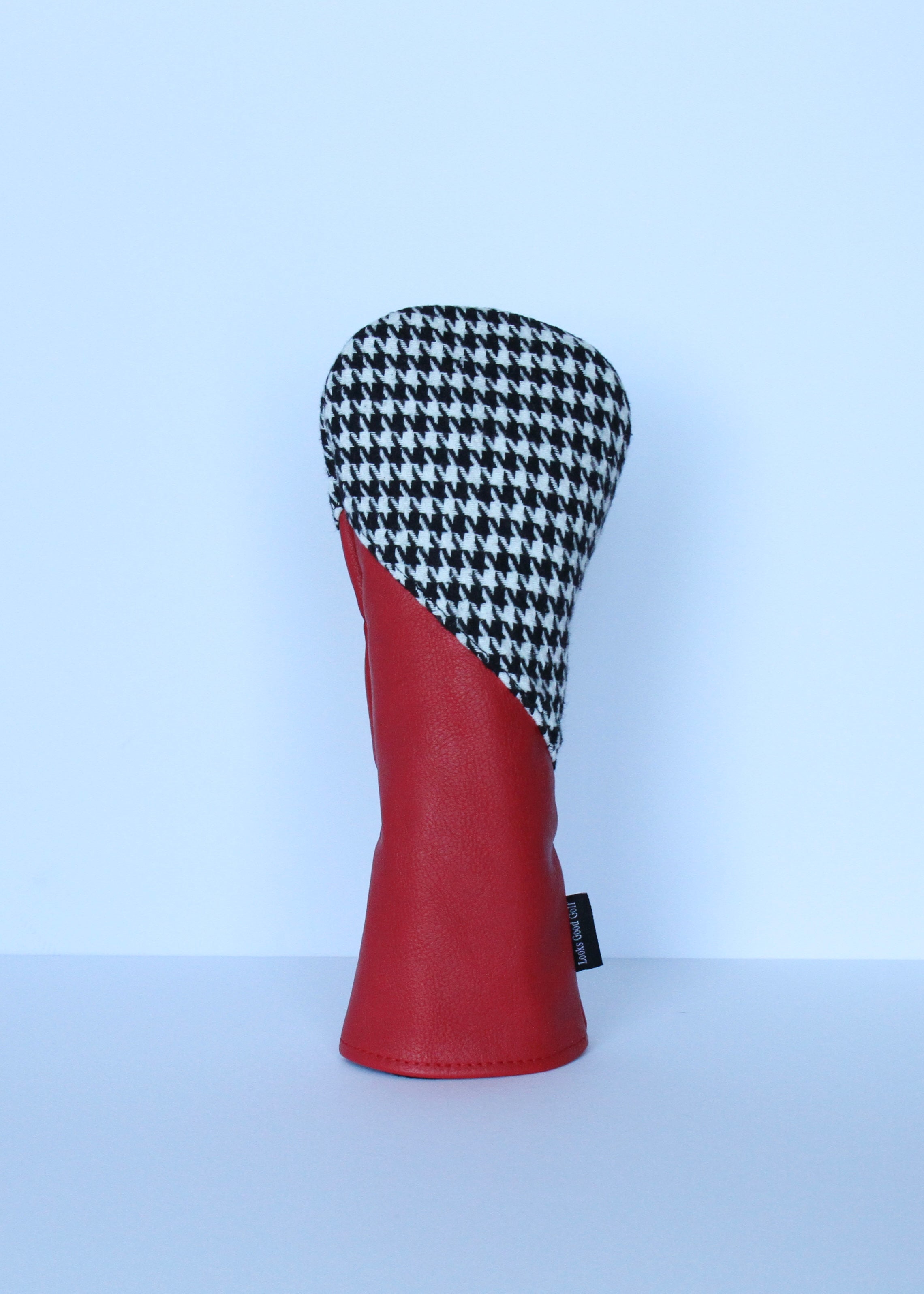 Crimson and houndstooth college golf fairway wood headcover with black fleece lining.