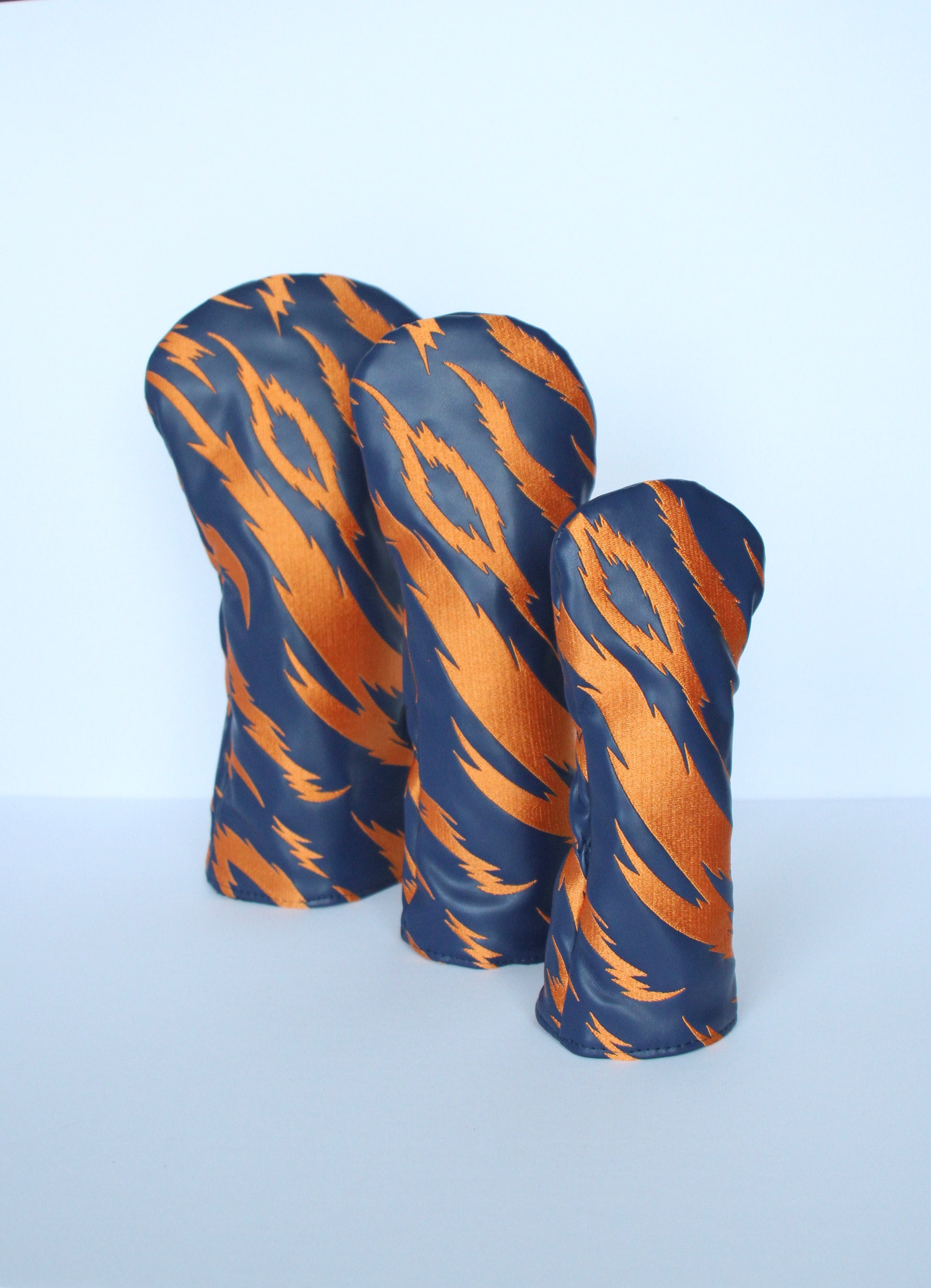 Navy and orange tiger stripe golf headcover set angled view – driver, fairway wood, hybrid by Looks Good Golf