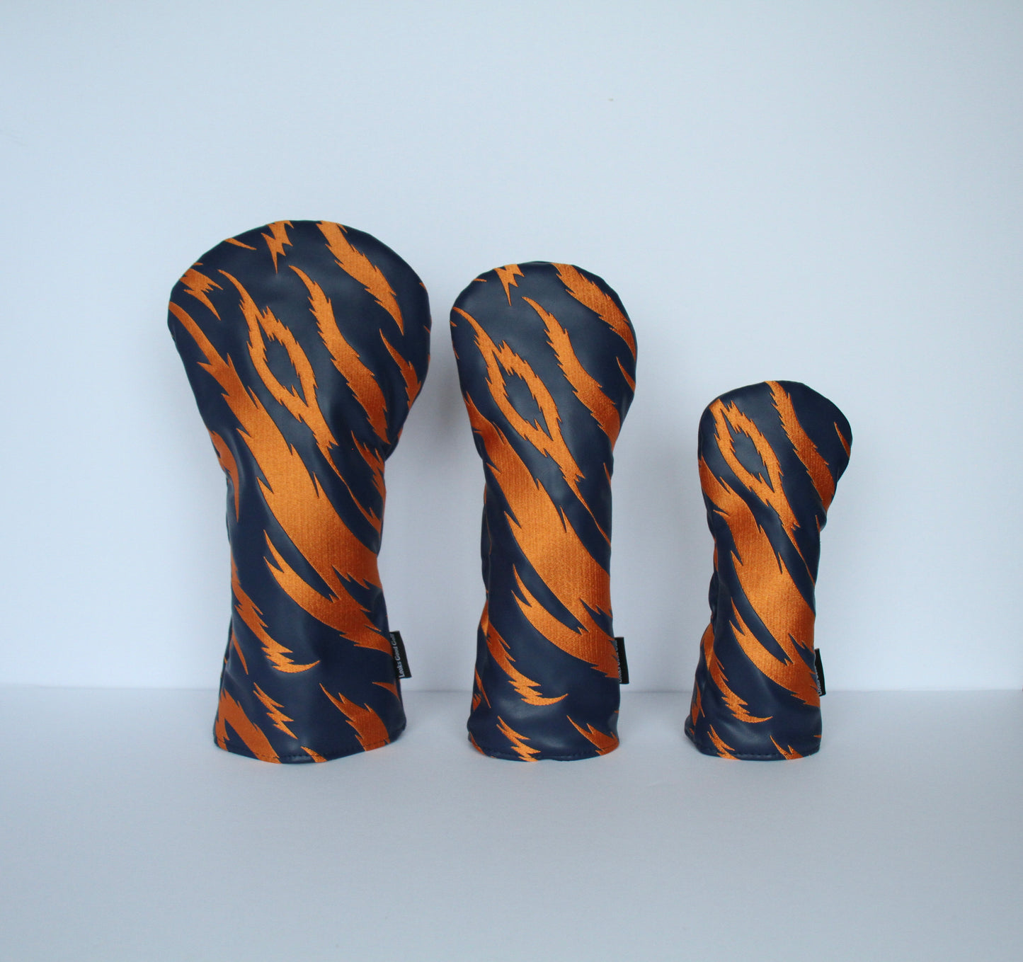 Navy and orange tiger stripe golf headcover set front view – driver, fairway wood, hybrid by Looks Good Golf