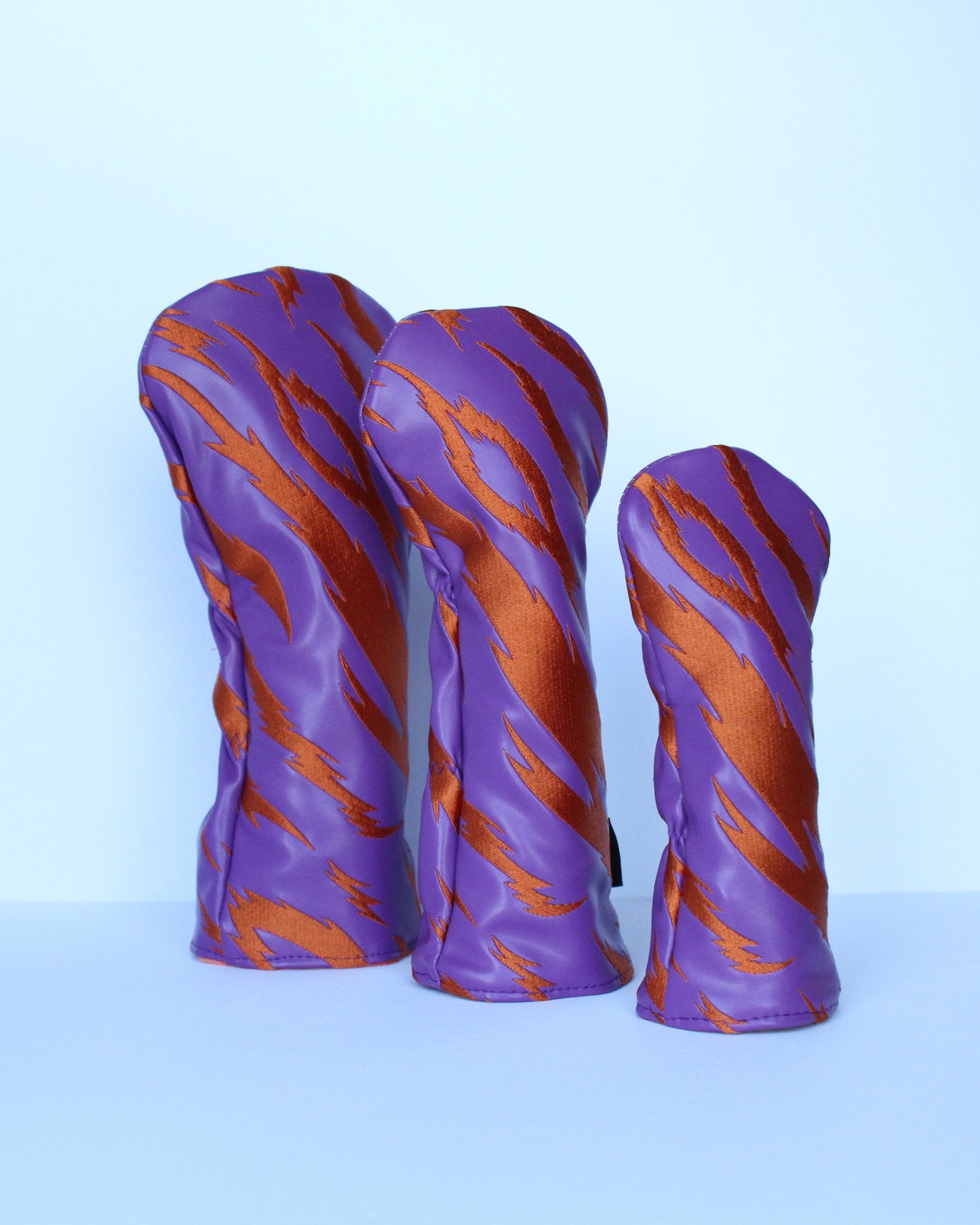 Purple and orange tiger stripe golf headcover 3-piece set angled view by Looks Good Golf