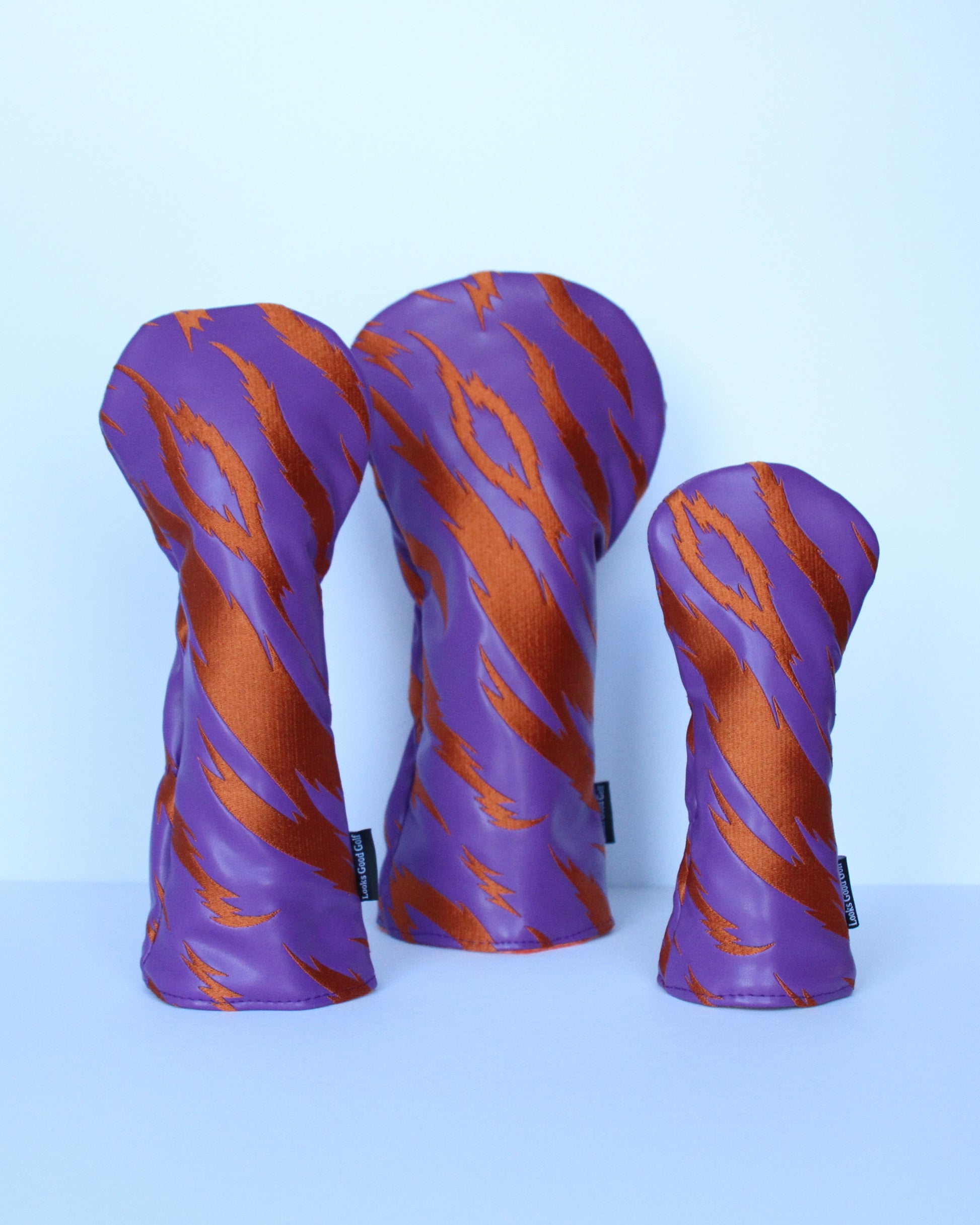 Purple and orange tiger stripe golf headcover 3-piece set grouped view by Looks Good Golf