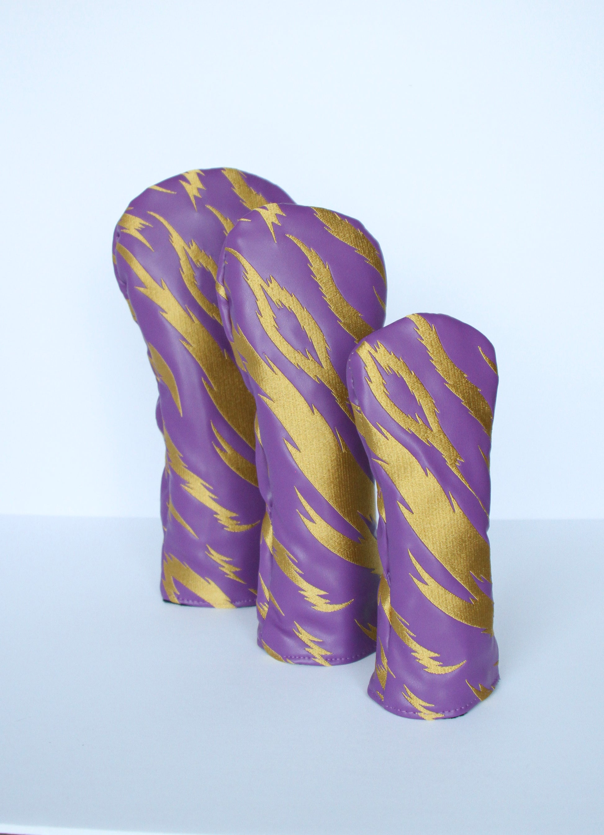 Purple and gold tiger stripe golf headcover 3-piece set angled view by Looks Good Golf