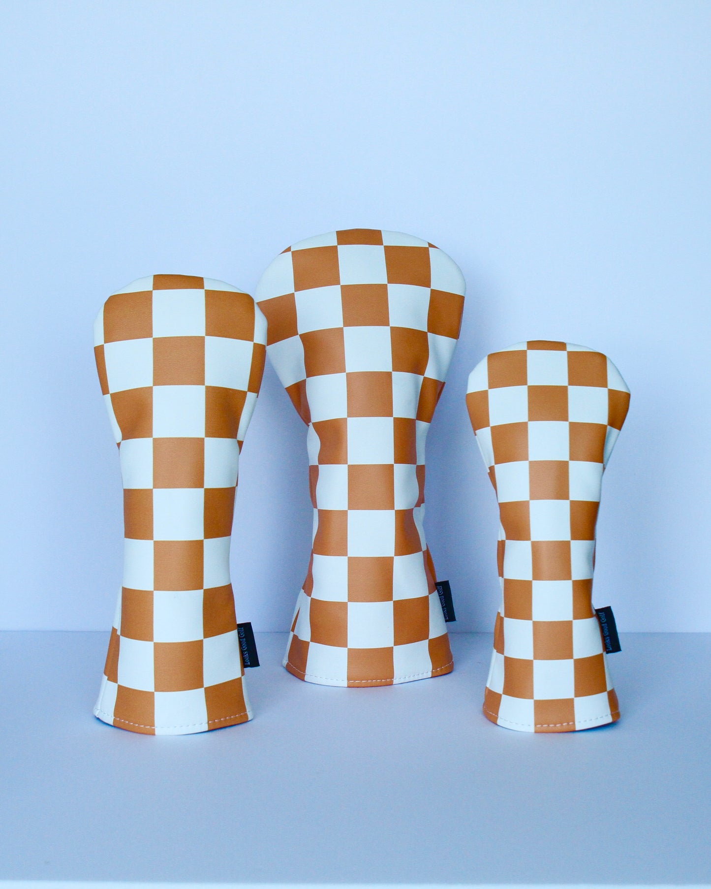 Orange and white checkerboard golf headcover set top-down view by Looks Good Golf